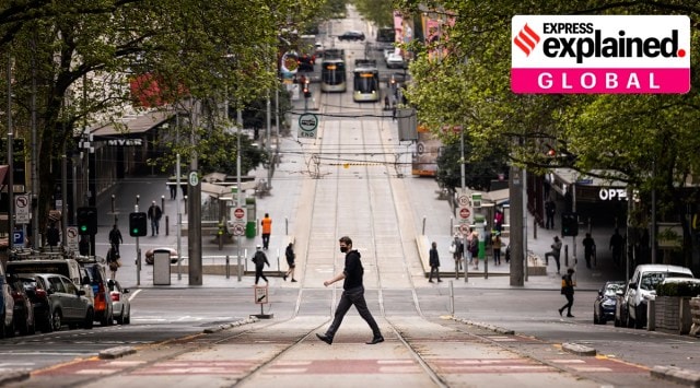 People cross Bourke Street in Melbourne, Thursday, Sept. 30, 2021, amid the Covid-19 pandemic. (Daniel Pockett/AAP Image via AP)