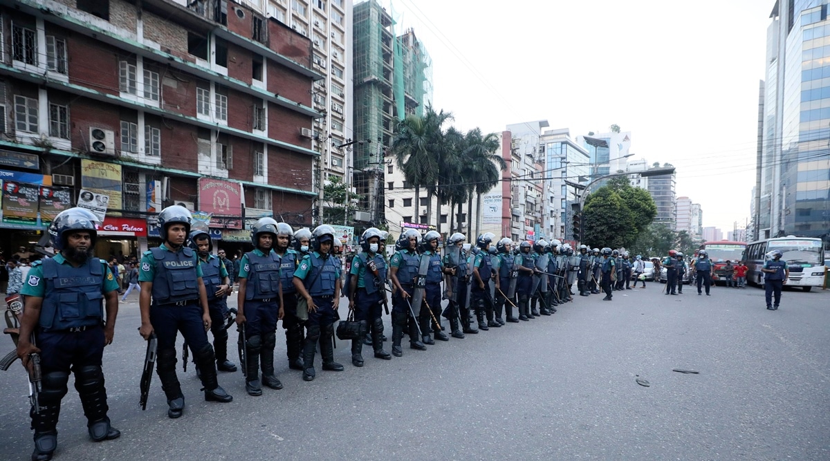 Riot police stand guard during a protest in Dhaka, Bangladesh, Saturday, Oct. 16, 2021. (AP)