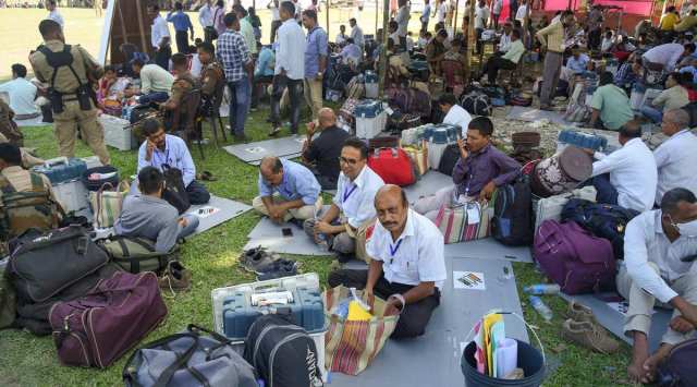 Election officials wait to leave for polling stations on the eve of bypolls to Musalpur seat, in Baksa district, Friday, Oct 29, 2021. (PTI Photo) 