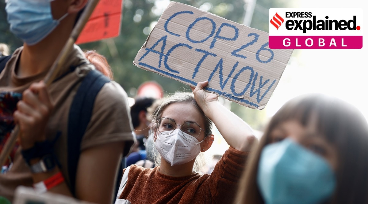 People take part in the 'Global march for climate justice' while environment ministers meet ahead of Glasgow's COP26 meeting, in Milan, Italy, October 2, 2021. (Reuters Photo: Guglielmo Mangiapane, File)