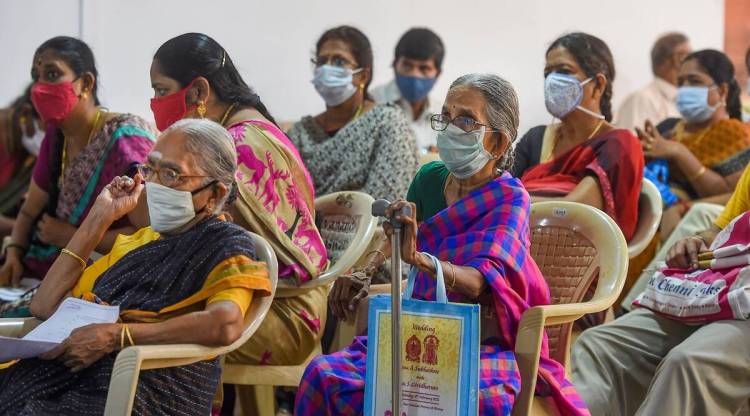 Beneficiaries wait after receiving the dose of COVID-19 vaccine at the Government Omandurar Medical College Hospital, in Chennai. (PTI)