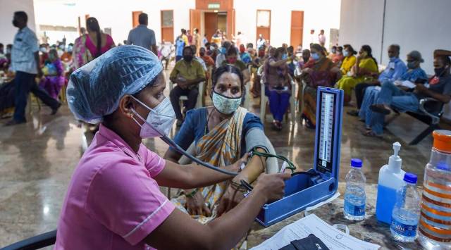 Beneficiaries get a blood pressure check before being administered the COVID-19 vaccine at the Government Omandurar Medical College Hospital, in Chennai. (PTI)