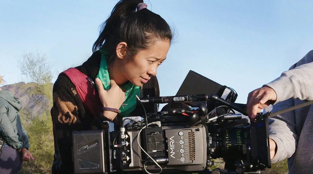 Chloé Zhao with film camera.