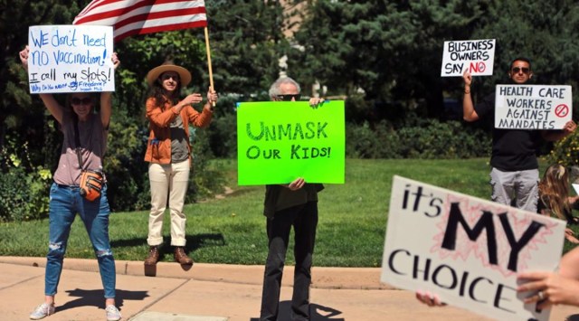 Protesters against vaccine and mask mandates demonstrate near the state capitol, in Santa Fe, New Mexico. (AP)