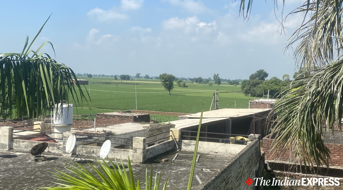 Border fence visible from the house of Suba Singh of Rajatal village in Amritsar. (Express photo/Man Aman Singh Chhina)