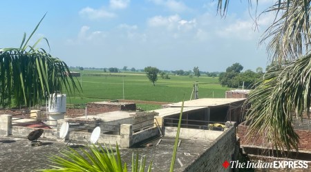 Border fence visible from the house of Suba Singh of Rajatal village in Amritsar. (Express photo/Man Aman Singh Chhina)