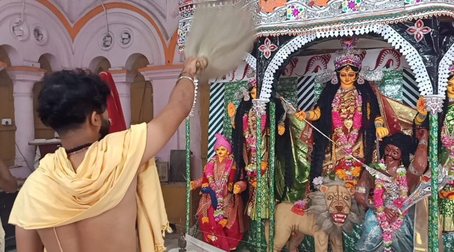 While most Durga Puja organisers have mellowed down their theme-based pandals this year due to the ongoing Covid-19 pandemic, the 183-year-old puja at Durga Bari, erstwhile temple of Tripura’s Manikya monarchs, is seeing a lot of devotees this year. (Express photo)