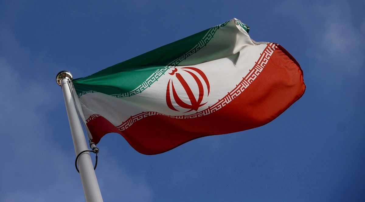 The Iranian flag waves in front of the International Atomic Energy Agency (IAEA) headquarters. (Reuters)