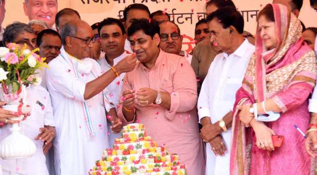 Senior party leader Digvijaya Singh offers cake to state Congress president Govind Singh Dotasra on his 56th birthday, in Jaipur on Friday. (Photo: Rohit Jain Paras)