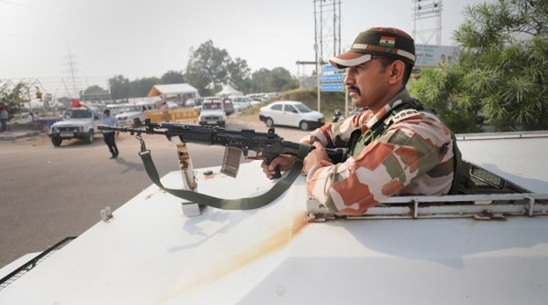 A security personnel stands guard near the venue of Union Home Minister Amit Shah’s scheduled public meeting in Jammu. (Photo: PTI)
