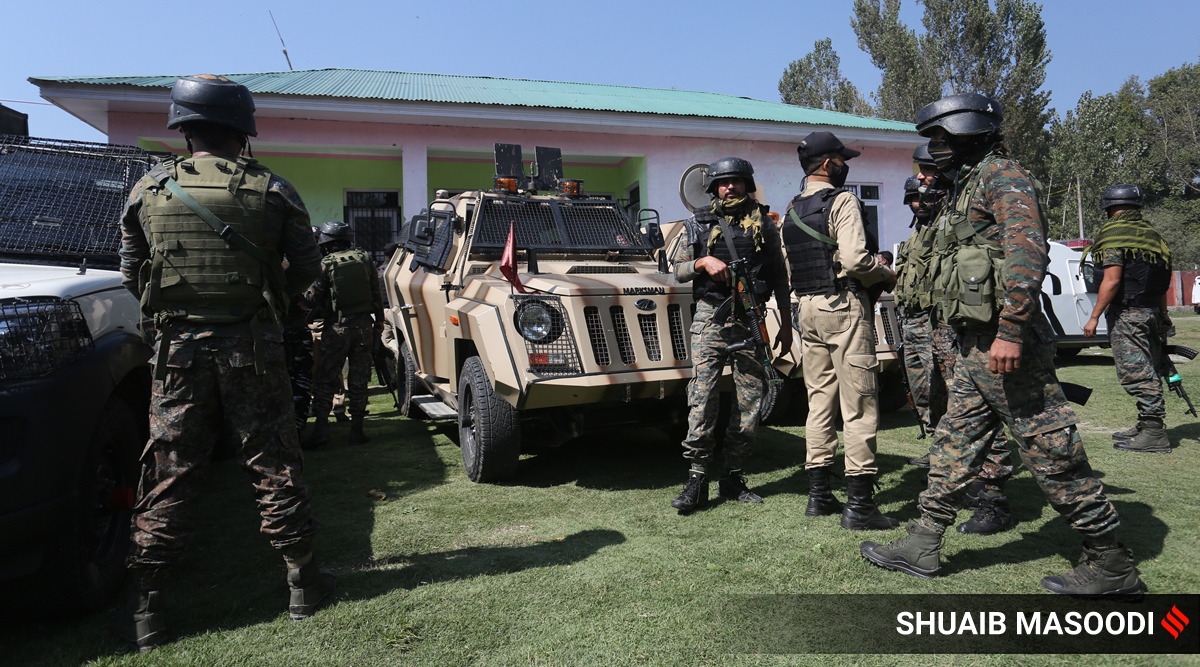 Security personnel at the government school where two teachers were shot dead by militants on Thursday.

