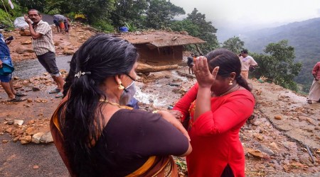 Kottayam: A woman breaks down as her house damaged in landslide due to heavy rain at Plappally pandalam in Kottayam District, Sunday, Oct. 17, 2021. (PTI Photo)