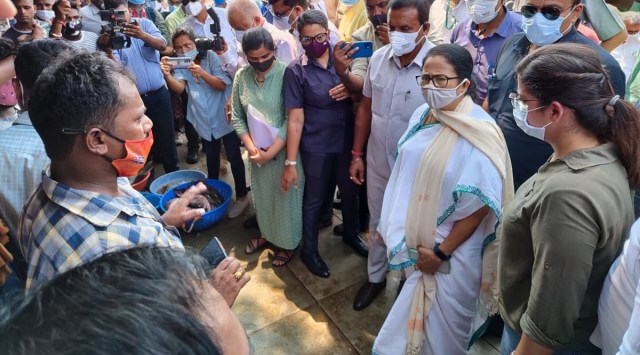 Mamata Banerjee interacts with fishermen at Betim on Thursday afternoon. (Express Photo)