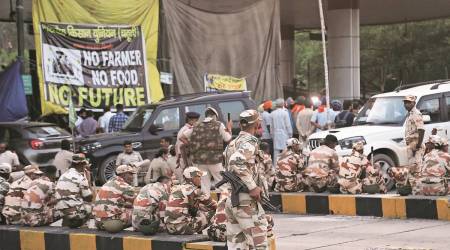 ITBP deployed at Chandimandir Toll Plaza during the farmers' protest on the issue of procurement; (top) a video grab of protestors  breaking police barricades; (below) farmers’ leader Gurnam Singh Chaduni reaches the site after police lathicharge on protesters, in Panchkula on Saturday. (Express Photo: Jaipal Singh)