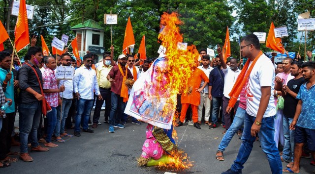 Vishva Hindu Parishad (VHP) and Bajrang Dal members burn an effigy of Bangladesh Prime Minister Sheikh Hasina during a protest against the alleged attack on Hindus in Bangladesh. (PTI)