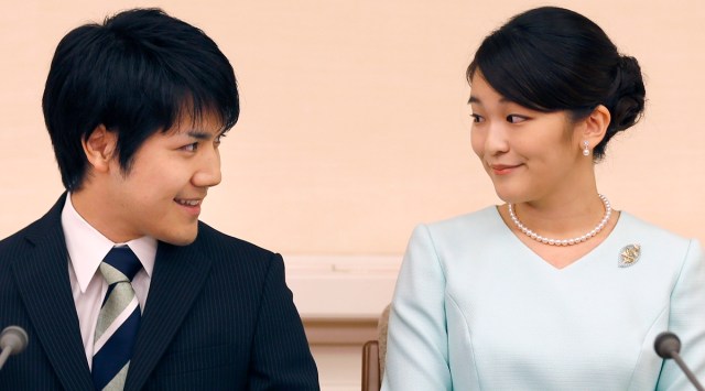 In this Sept. 3, 2017, file photo, Japan's Princess Mako and her fiance Kei Komuro look at each other during a press conference at Akasaka East Residence in Tokyo. (AP)