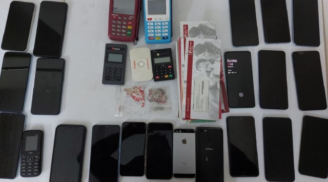 A total of 20 mobile phones, 160 SIM cards, 19 debit cards, four swiping machines, 148 grams gold ornaments, a Honda city car and cash worth Rs 11,20,000 were seized.
