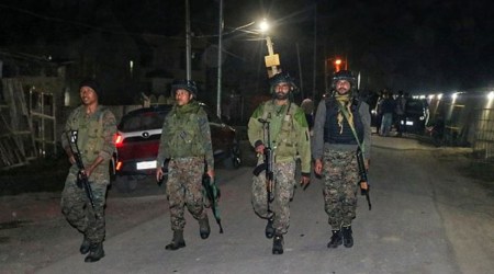Security personnel during an encounter at Bemina area in Srinagar, Friday, Oct. 15, 2021. One militant was killed. (PTI Photo)