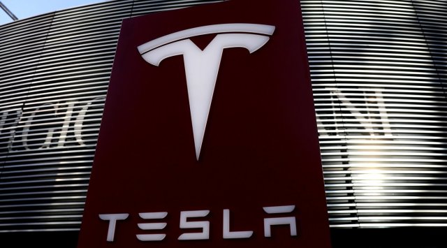 A logo of the electric vehicle maker Tesla is seen near a shopping complex in Beijing, China. (Reuters)