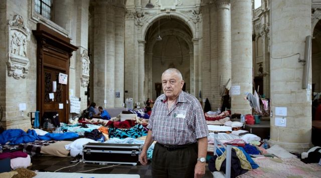 The Rev. Daniel Alliët, a 77-year old Catholic priest who provides shelter for undocumented migrants, at St. John the Baptist Church in Brussels, Aug. 5, 2021. (Ksenia Kuleshova/The New York Times)
