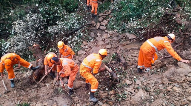Chamoli: National Disaster Response Force (NDRF) personnel carry out rescue operations in a landslide-affected area following heavy rains in Dungree village of Chamoli district. (PTI Photo)