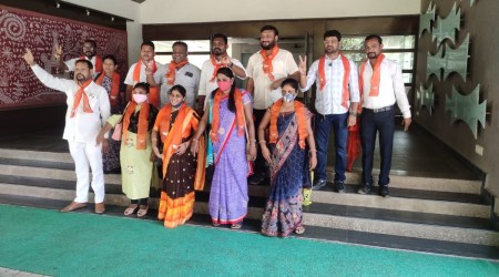 Congress leader Jasuben Gamit and other members who joined the BJP on Saturday. (Express)