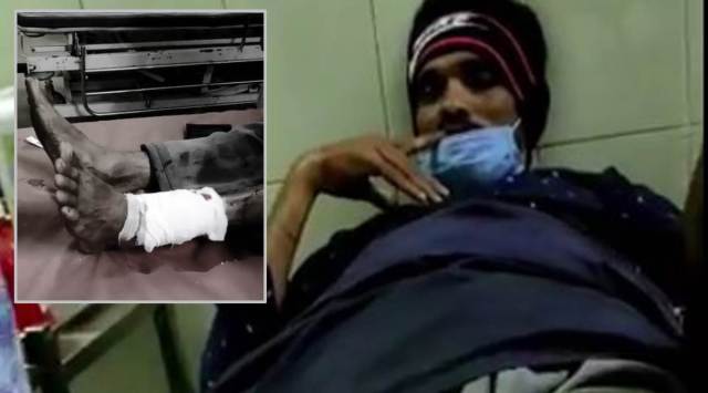 Hasab Saab photographed at the hospital. His injured leg is seen in the inset.