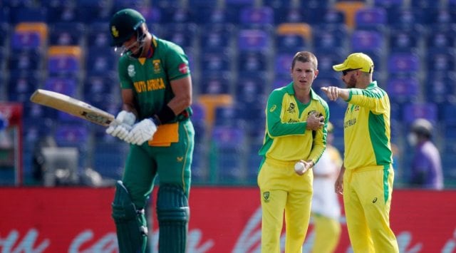 Australia captain Aaron Finch speaks to bowler Adam Zampa during the match REUTERS/Hamad I Mohammed