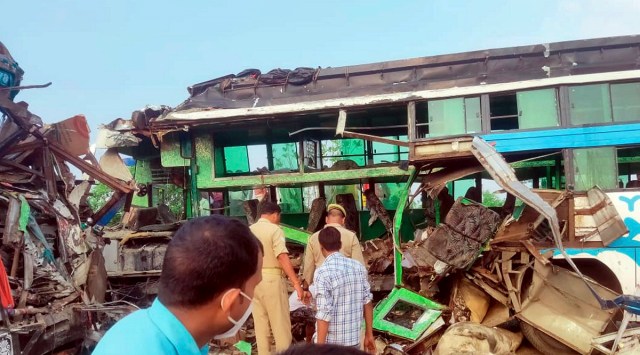 Mangled remains of a vehicle after it collided with a truck in Barabanki district. (PTI)