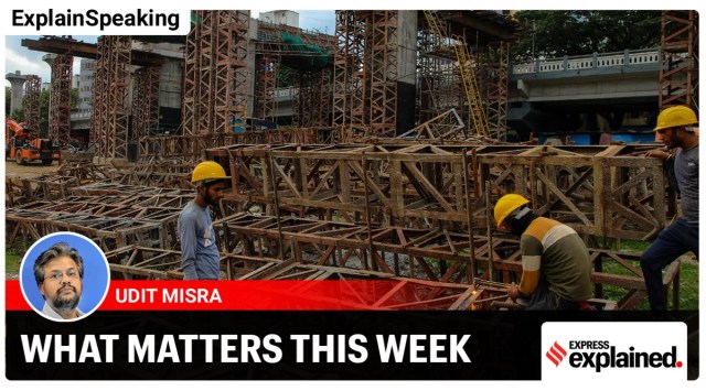 Workers dismantle huge metal blocks for the metro pillar work near Mutha river in Pune. (Express photo/Ashish Kale)