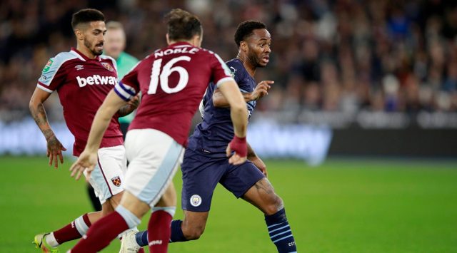 Manchester City's Raheem Sterling, right, controls the ball during the English League Cup fourth round soccer match between West Ham United and Manchester City, at the London Stadium, in London, Wednesday, Oct. 27, 2021. (AP Photo/Ian Walton)