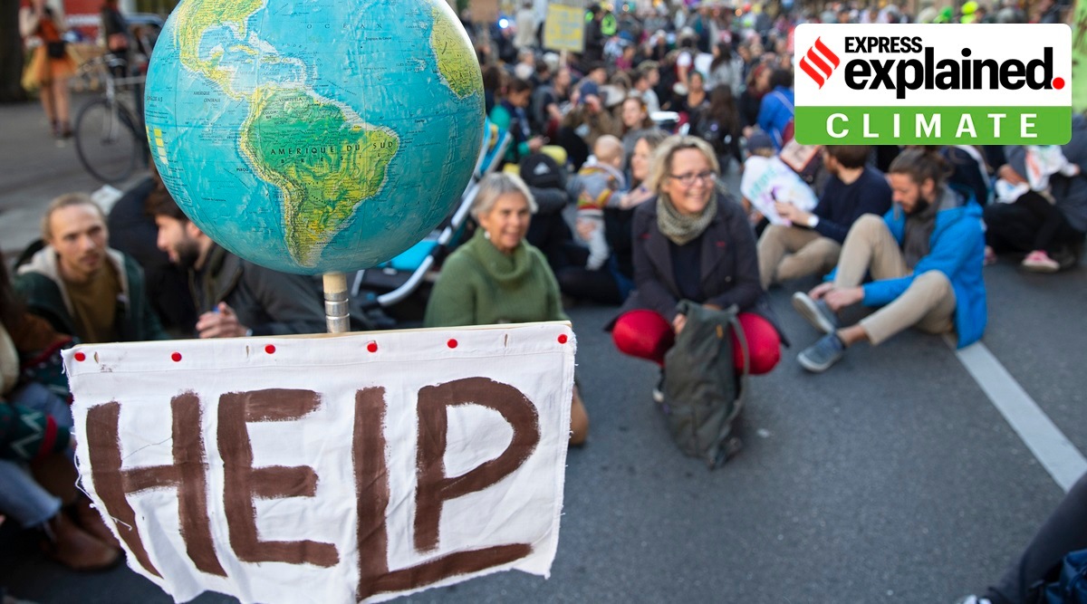 People attends a Global Climate Strike demonstration during the international strike day of Fridays For Future, in Geneva, Switzerland, Friday, Oct. 22, 2021. (Salvatore Di Nolfi/Keystone via AP)