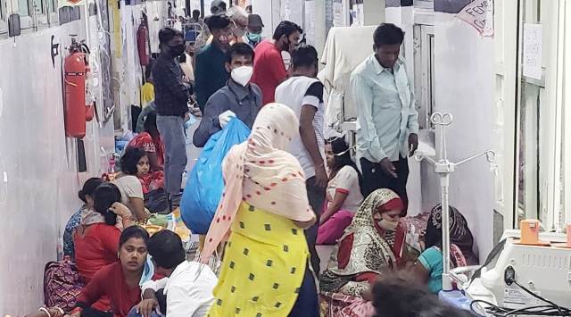 In Safdarjung hospital, patients were on the floor on both sides of the corridors, along with bystanders. (Express photo by Tashi Tobgyal)