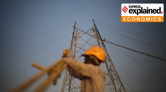 Workers put up wires at a construction site in New Delhi. (Express Photo: Tashi Tobgyal, File)