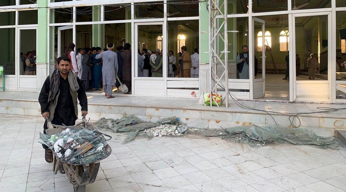 People inspect the inside of a mosque following a suicide bombers attack in the city of Kandahar, southwest Afghanistan on Oct. 15, 2021. (AP)