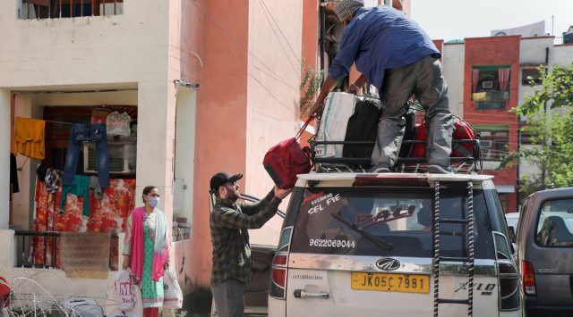 Kashmiri Pandit families return to a migrant camp in Jammu on Saturday. (Photo: PTI)
