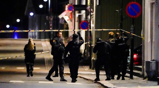 Police officers investigate after several people were killed and others were injured by a man using a bow and arrows to carry out attacks, in Kongsberg, Norway on Oct 13, 2021. (Hakon Mosvold/NTB/via Reuters)