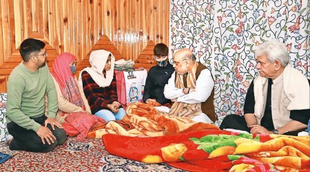 Union Home Minister Amit Shah at the residence of J&K Police officer Parvez Ahmed who was killed last month, in Nowgam on Saturday. (Photo: PTI)