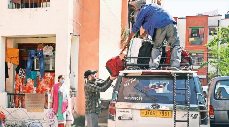 Kashmiri Pandit families return to a migrant camp in Jammu on Saturday. (Photo: PTI)
