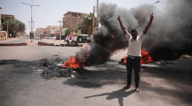 People burn tires during a protest a day after the military seized power Khartoum, Sudan, Tuesday, Oct. 26, 2021. (AP Photo/Marwan Ali)