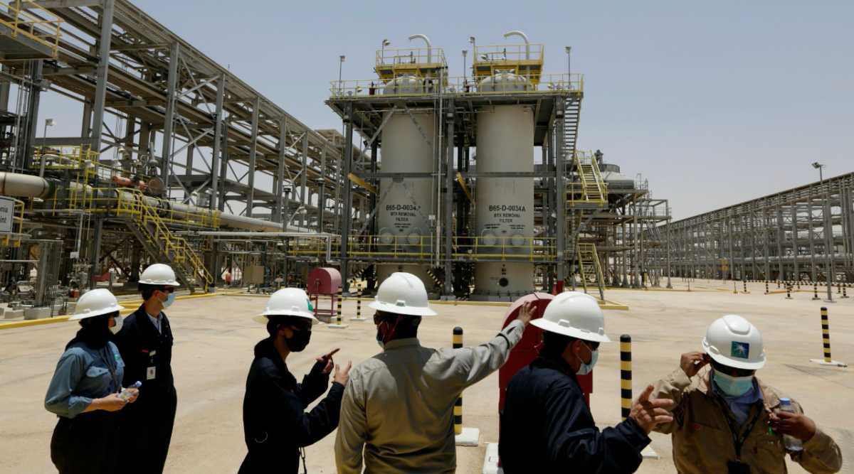 Saudi Aramco engineers and journalists look at the Hawiyah Natural Gas Liquids Recovery Plant in Hawiyah, in the Eastern Province of Saudi Arabia. (AP Photo/File)