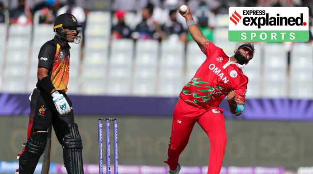 Oman's Khawar Ali bowls during the Cricket Twenty20 World Cup first round match between Oman and Papua New Guinea in Muscat, Oman, Sunday, Oct. 17, 2021. (AP Photo/Kamran Jebreili)