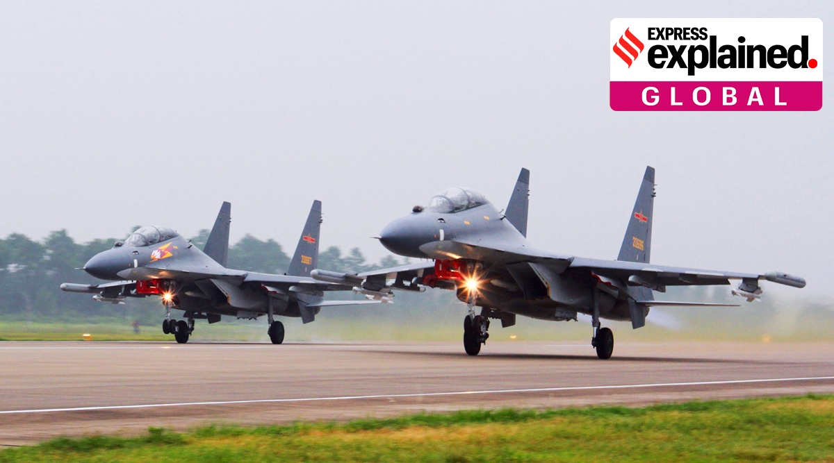 In this undated file photo released by China's Xinhua News Agency, two Chinese SU-30 fighter jets take off from an unspecified location to fly a patrol over the South China Sea. (AP)