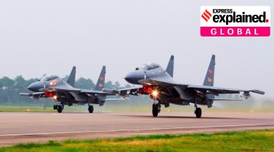 In this undated file photo released by China's Xinhua News Agency, two Chinese SU-30 fighter jets take off from an unspecified location to fly a patrol over the South China Sea. (AP)