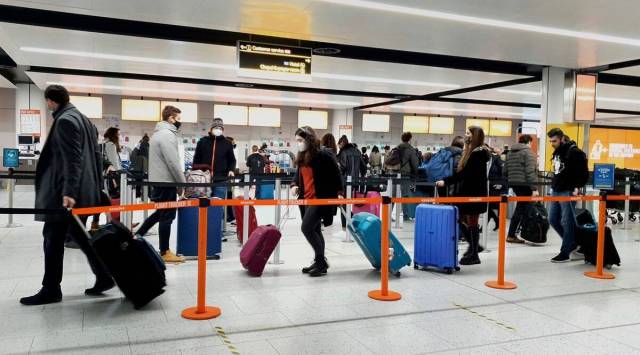The government has said that from later in October, arrivals in England will no longer have to take a PCR test two days after arrival and can instead opt for the cheaper lateral flow test. (Gareth Fuller/PA via AP)