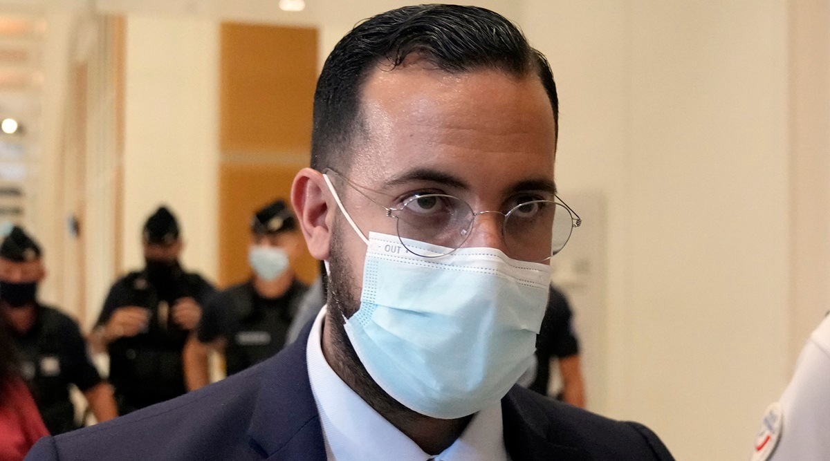 Alexandre Benalla, a former security aide to President Emmanuel Macron leaves the court house on the first day of trial in Paris, Monday, Sept. 13, 2021. Benalla who triggered a political crisis by beating a protester at a 2018 May Day march was convicted Friday of illegal violence and other offenses and sentenced to spend a year under house arrest.  (AP)