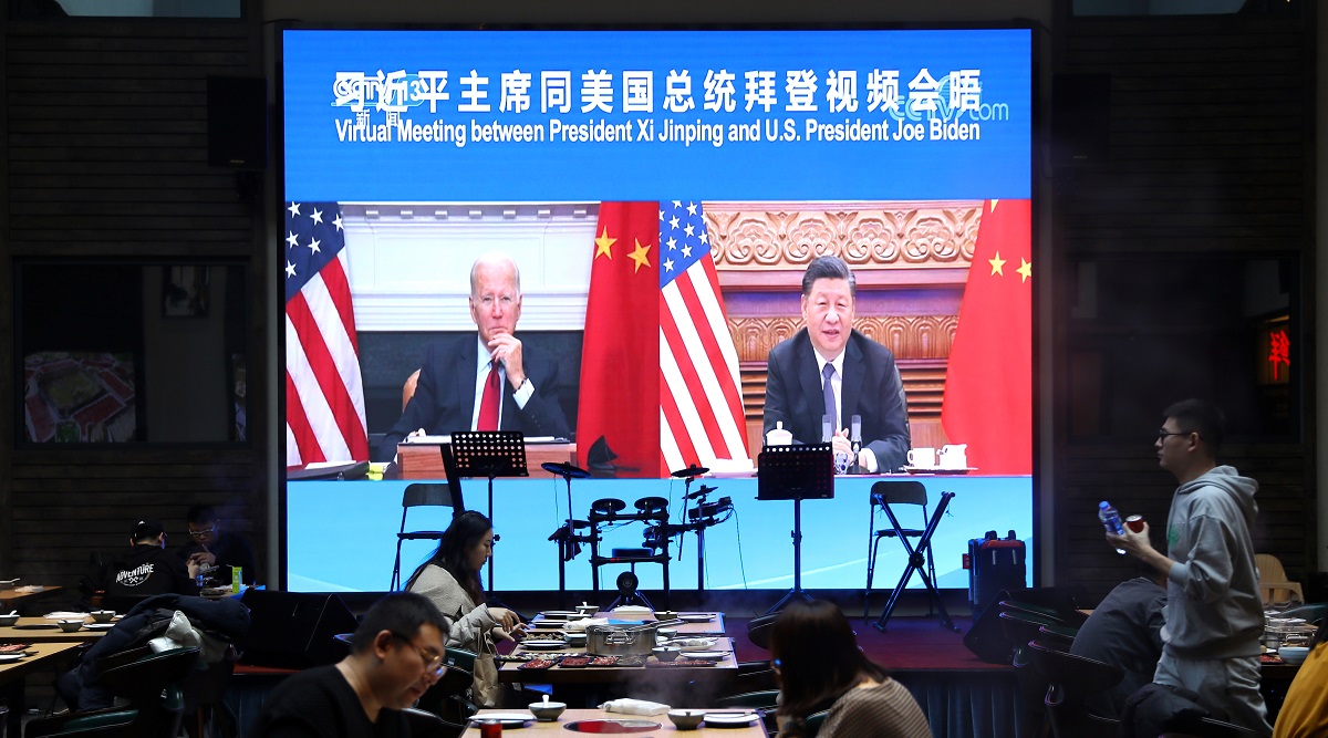 A screen shows Chinese President Xi Jinping attending a virtual meeting with U.S. President Joe Biden via video link. (Reuters)