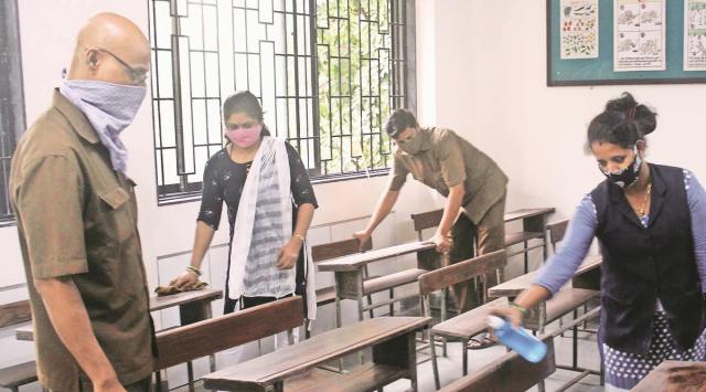 A primary school sanitises a classroom in Thane on Tuesday.  (Deepak Joshi)