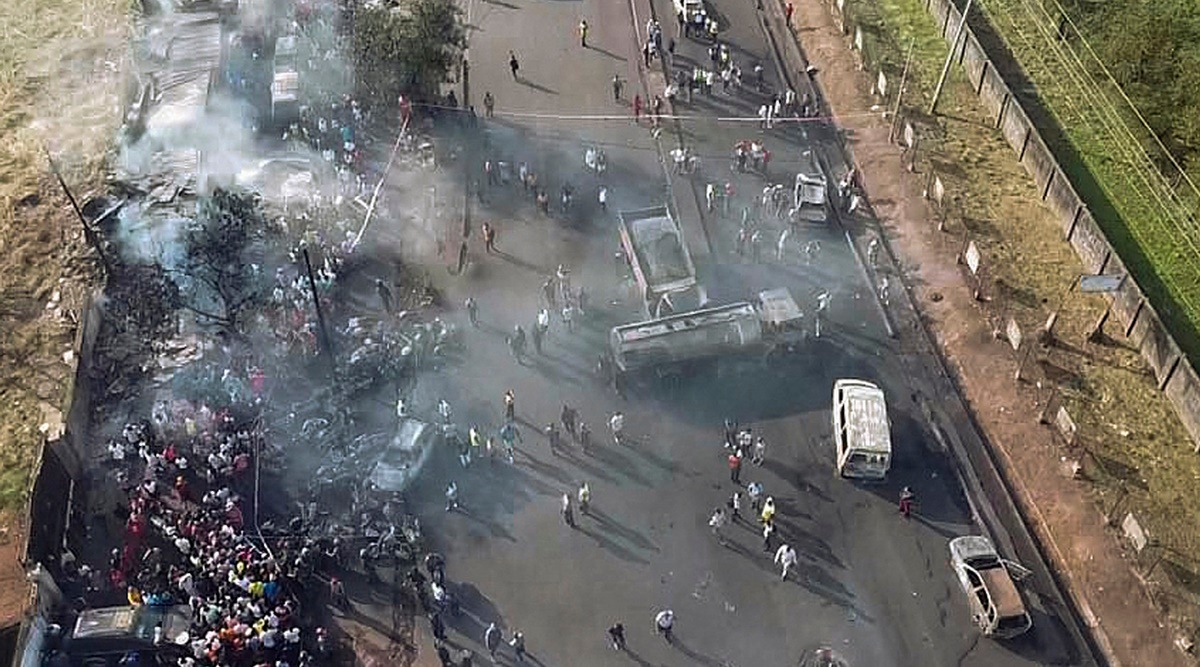 Freetown: In this photograph issued Saturday Nov. 6 2021 by Sierra Leone's National Disaster Management Agency, people gather around the charred oil tanker that exploded after being struck by a truck in the Wellington suburb of Sierra Leone's capital Freetown Saturday Nov. 6, 2021. Scores died in the explosion that happened late Friday Nov. 5. (AP)