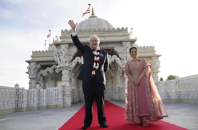 Boris Johnson joins Priti Patel for Diwali prayers at London temple